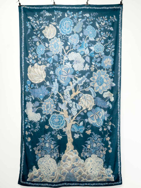 Floral cotton curtain with blue and white design on a dark blue background