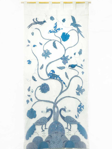 Decorative curtain with blue peacock and floral pattern on a white background