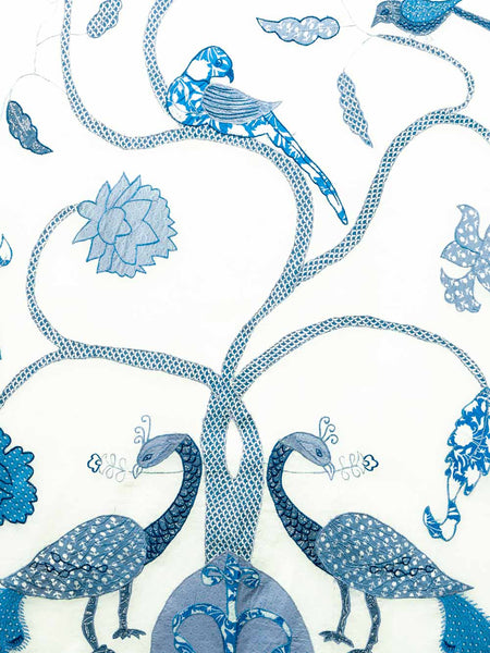 Decorative curtain with blue birds and flowers on a white background