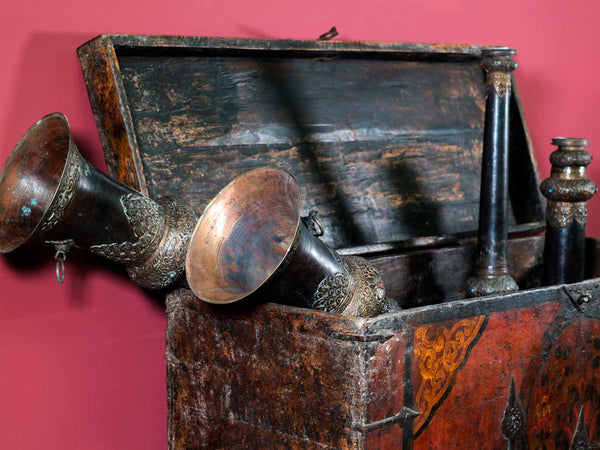 Tibetan dungchen and antique chest