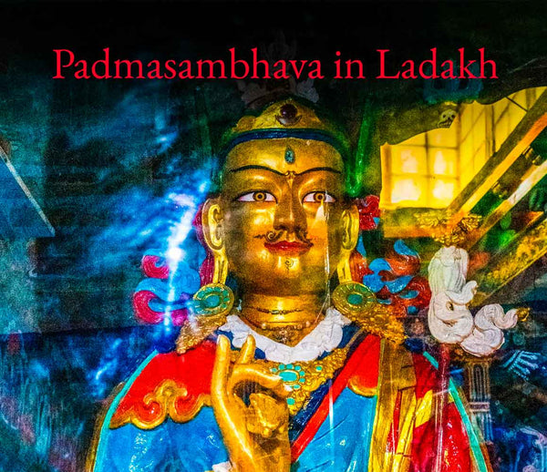 A colorful poster-style artwork showing a golden statue of a Tibetan deity or Buddha figure with red, blue, and white garments, set against a dark illustrated background. Red text at the top reads 'Padmasambhava in Ladakh'.