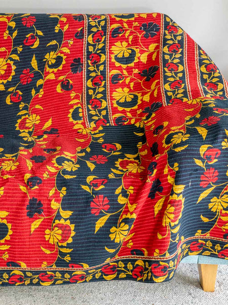 Colorful floral-patterned fabric draped over a chair