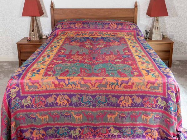 Colorful patterned bedspread on a bed 
