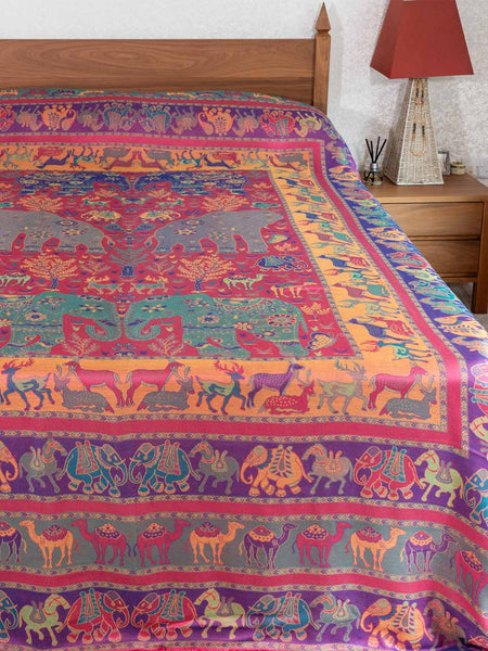 Colorful patterned bedspread on a bed 