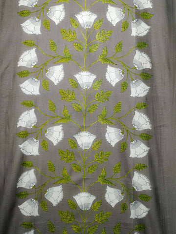 Embroidered cotton curtain with white floral patterns and green leaves on a gray background