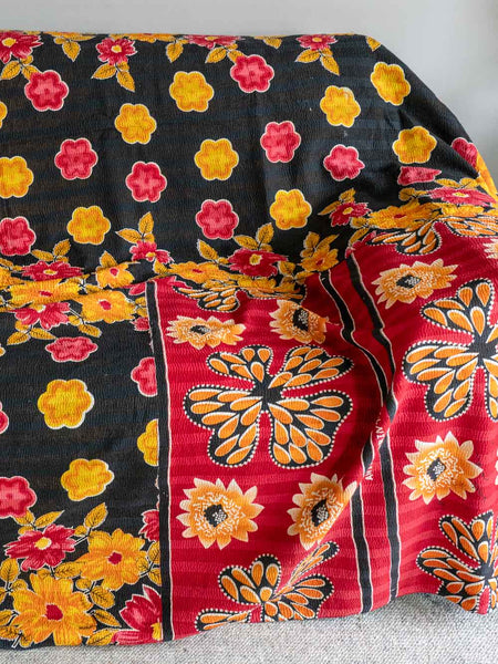 Colorful floral-patterned fabric with black background