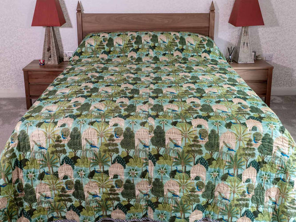 Light green forest print quilted bedspread