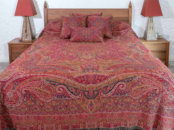 Swirling Paisley patterned red multicoloured bedspread & cushions