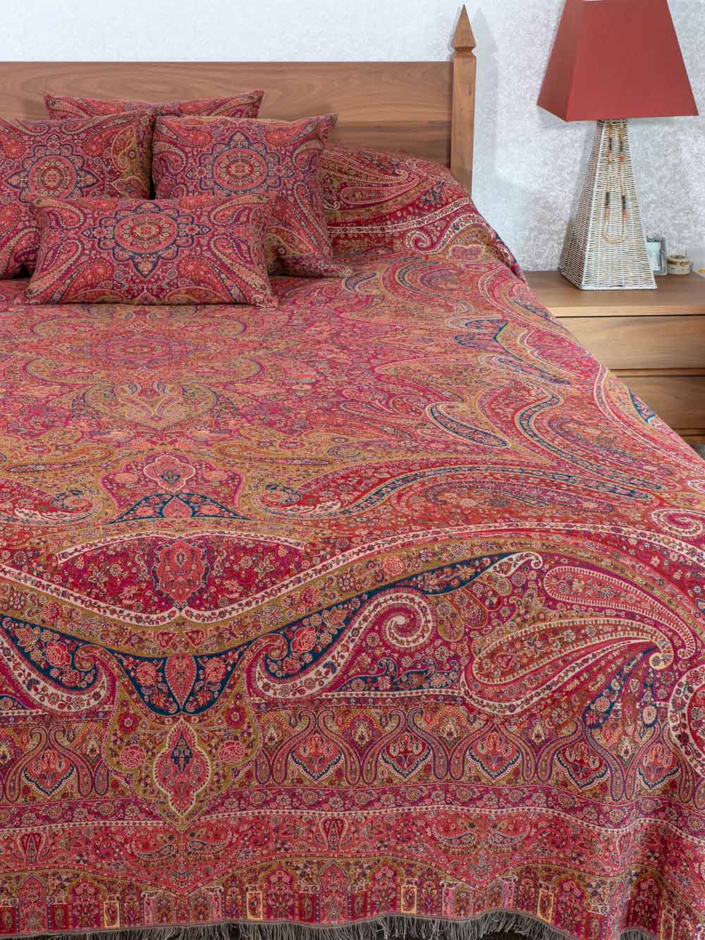 Swirling Paisley patterned red multicoloured bedspread