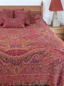 Swirling Paisley patterned red multicoloured bedspread