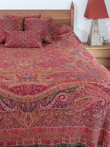 Swirling Paisley patterned red multicoloured bedspread
