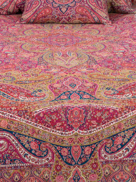 Close-up of a Swirling Paisley patterned red multicoloured bedspread