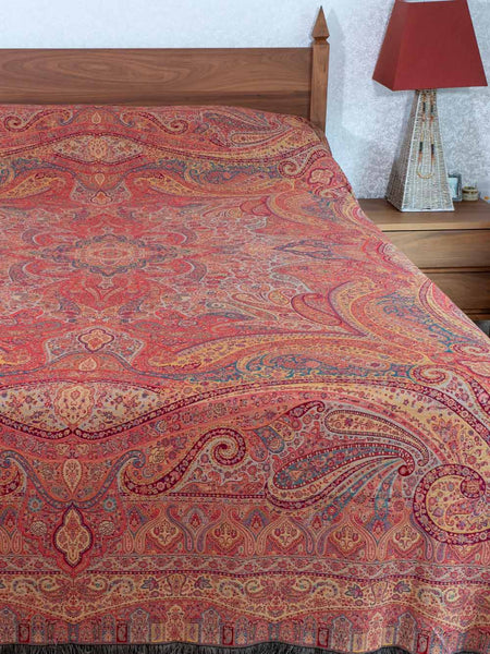 Swirling Paisley patterned red multicoloured bedspread