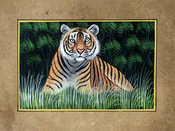 Indian Painting of a tiger in a natural setting with green grass and foliage.