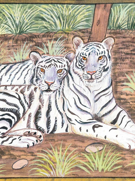 A painted scene of two white tigers resting on brown ground with green grass and a tree trunk in the background.