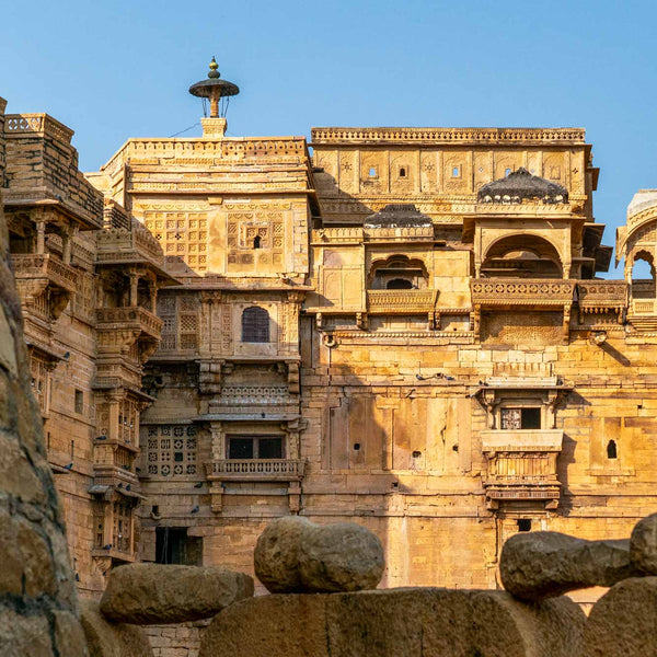 Jaisalmer Fort with intricate carvings under a clear blue sky