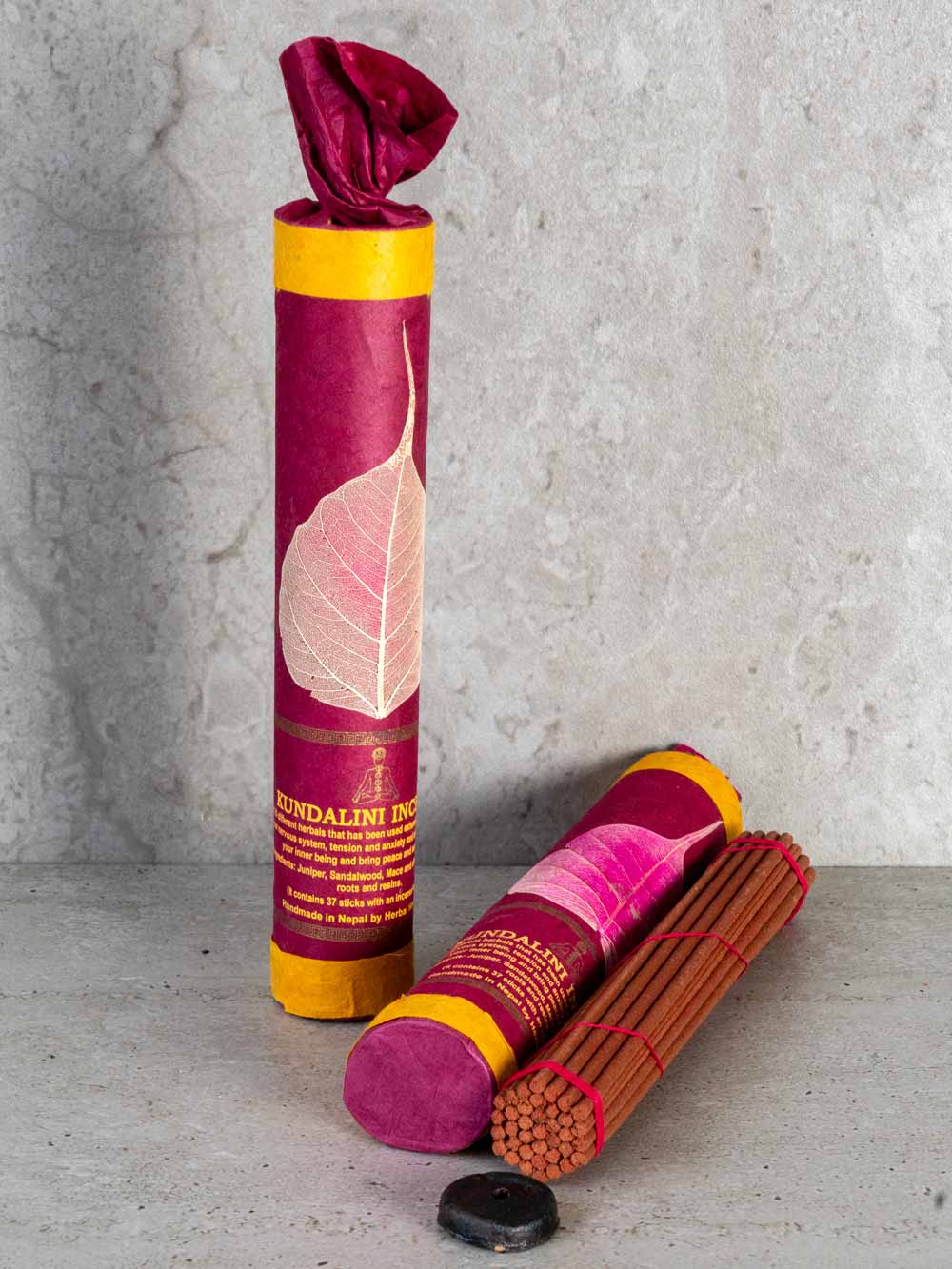Kundalini Tibetan Incense in a dark red tube
