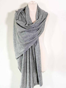 Gray scarf draped over a mannequin on a white background