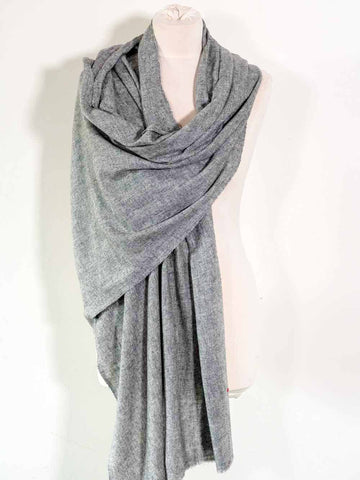 Gray scarf draped over a mannequin on a white background
