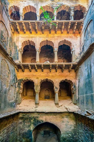Historic architectural interior with arches and stone walls
