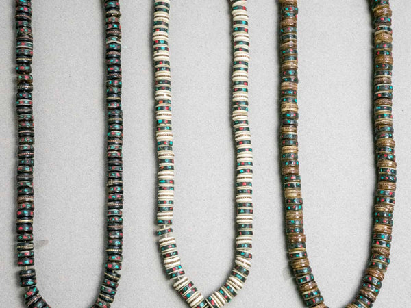 Detail of Tibetan malas made from old inlaid beads.