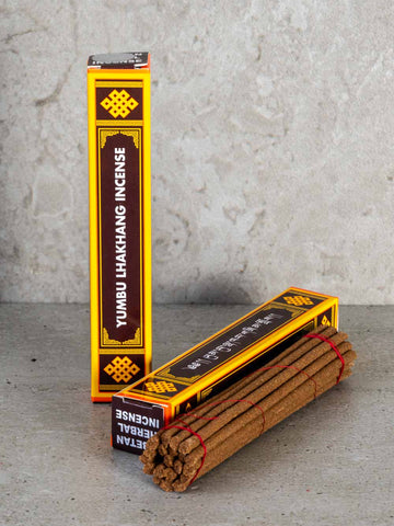 Yumbu Lhakhang incense sticks with packaging on a gray surface