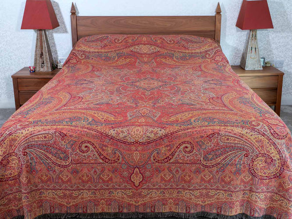 Swirling Paisley patterned red multicoloured bedspread