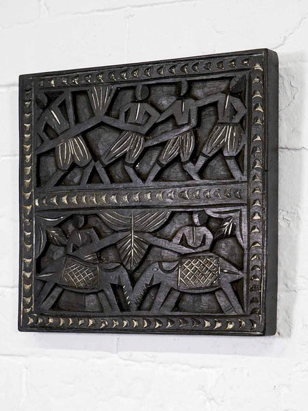 Carved Wooden Panel with Tribal Carvings