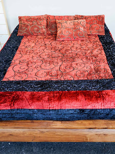 Red and black velvet Turkoman quilt with gold detail